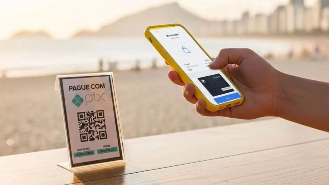 Persona usando teléfono móvil para pagar con código QR de PIX en Brasil